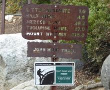 John Muir trail signs remind hikers to carry their permits